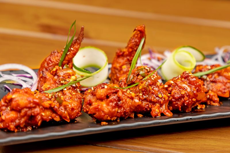 Nashville Hot Boneless Wings with cayenne sauce